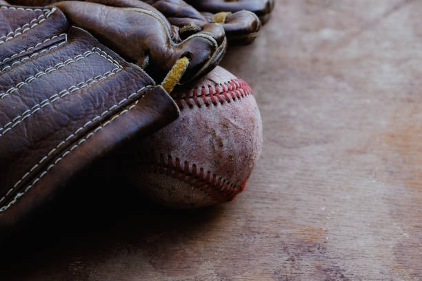 istock Old used baseball equipment background 1352091746