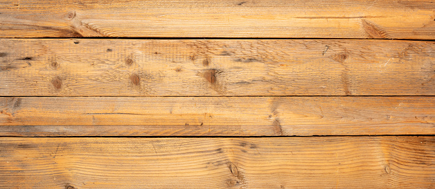 Wood background, texture. Rustic weathered barn wood background with knots and nail holes. Rough wooden planks board, banner