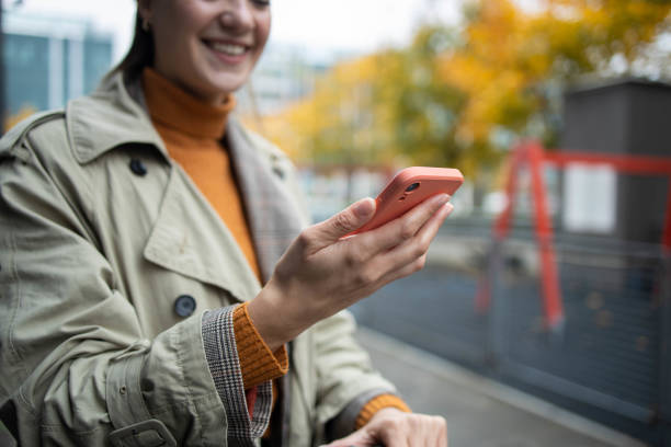 istock Modern Caucasian woman on electric scooter using mobile 1352094317