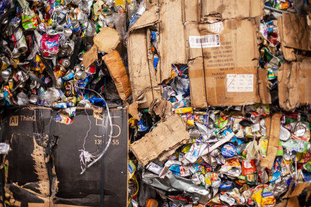 istock Broken cardboard boxes filled with aluminum cans 1352094678
