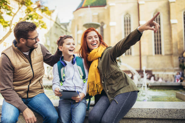 istock Young parents taking their little child to school 1352096733