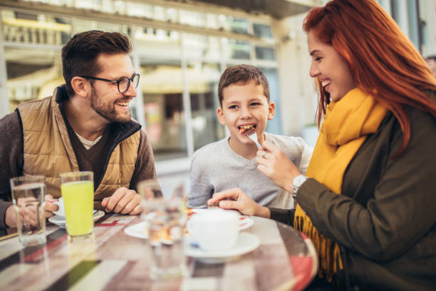 istock Trendy young couple in town using tablet 1352098108