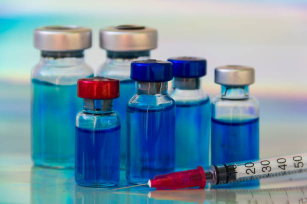 istock group of vaccine vials and syringe 1352098566
