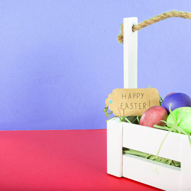istock Colorful background with Easter eggs on red and blue background. Happy Easter concept. Can be used as poster, background, holiday card. Flat lay, top view, copy space. Studio Photo 1352100515