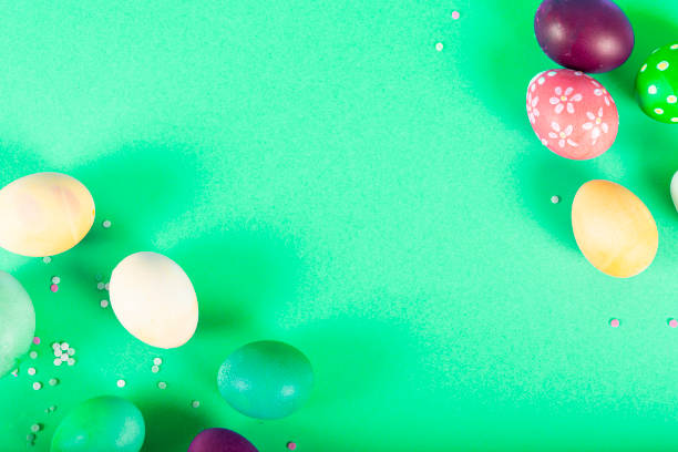 istock Colorful background with Easter eggs on green background. Happy Easter concept. Can be used as poster, background, holiday card. Flat lay, top view, copy space. Studio Photo 1352102339