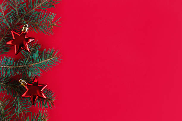 istock Christmas background with spruce branches and red ornaments. 1352102430