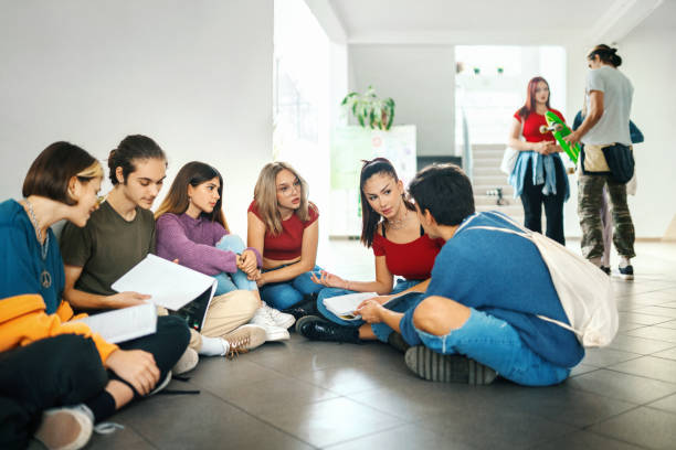 istock Highschool students on a break in  the hallway. 1352103308