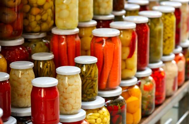 istock Organic preserved vegetable in a glass jars. 1352103322