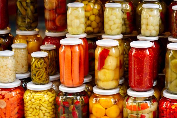 istock Organic preserved vegetable in a glass jars. 1352103325