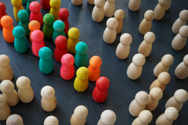 Equality rights and diversity concept. Color figurines and wooden ones. Equality rights and diversity concept. Color figurines and wooden ones. multiculturalism stock pictures, royalty-free photos & images