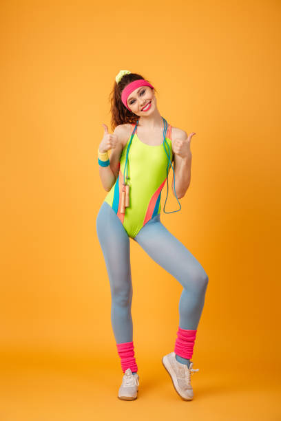 istock Cheerful sportswoman with jumping rope standing and showing thumbs up 1352105708