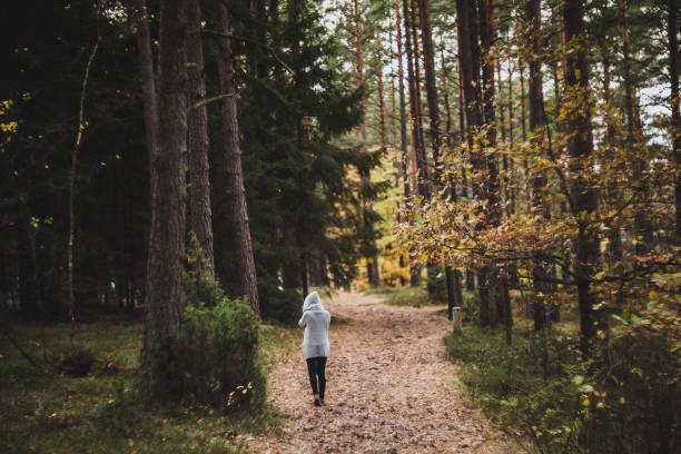 istock Woman in the forest 1352106184