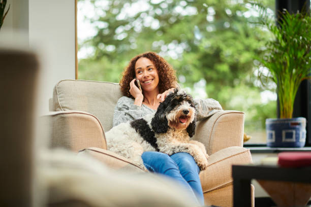 istock chatting on the phone with her dog 1352107096