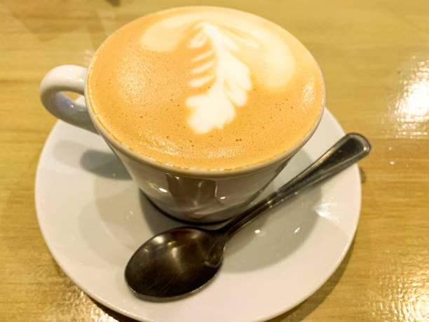 istock Cup of cappuccino with pattern on the froth. 1352107447