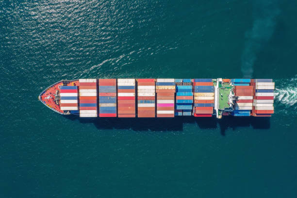 istock Aerial top view container ship full load container for logistics import export, shipping or transportation concept background. 1352107817
