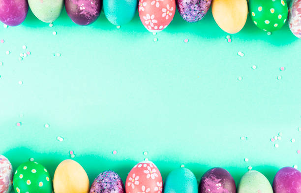 istock Colorful background with Easter eggs on green background. Happy Easter concept. Can be used as poster, background, holiday card. Flat lay, top view, copy space. Studio Photo 1352108665