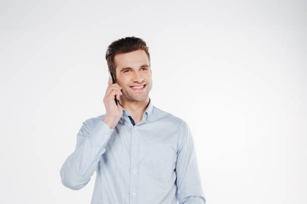 istock Man in shirt talking on phone 1352110733