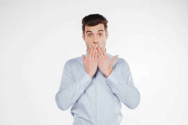 istock Shocked business man covering mouth 1352111507