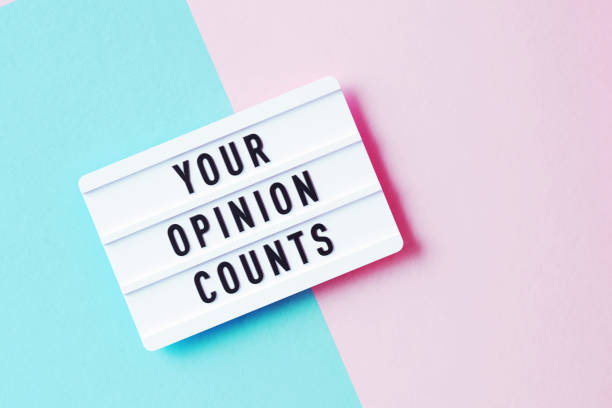 istock Customer Satisfaction Survey Concept - Your Opinion Counts Written White Lightbox Sitting On Pink And Blue Background 1352112976