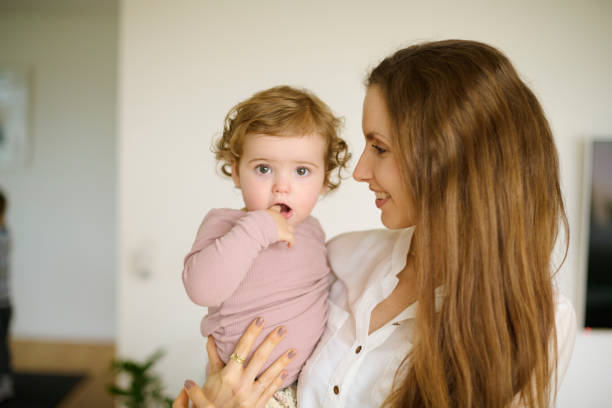 istock Young mother with long hair 1352113028