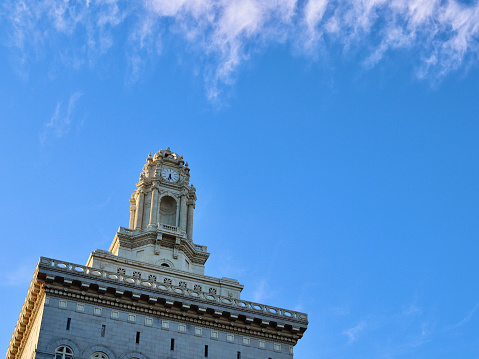 Upward view of the tower atop Oakland City  Hall in Oakland, California on a sunny day.