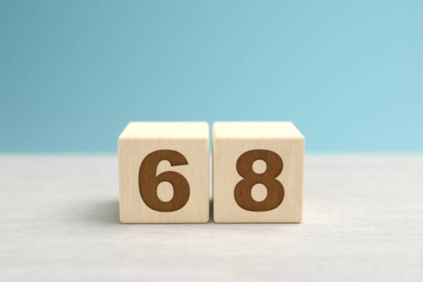 istock Wooden toy blocks forming the number 68. 1352116331