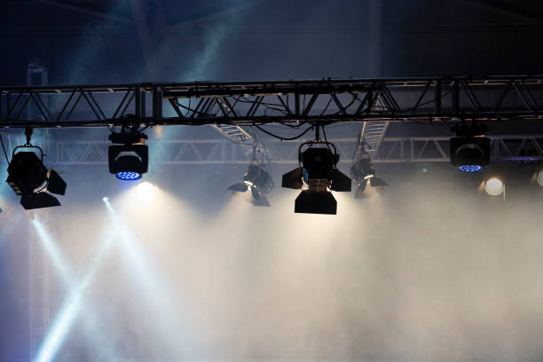 Boxing ring arena spot lights, smoke and dark night scene.