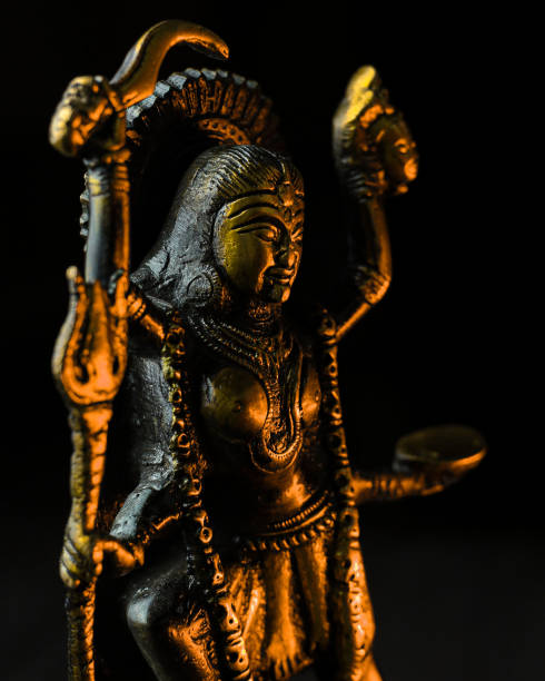 istock Kali goddess golden statue on black background 1352120644