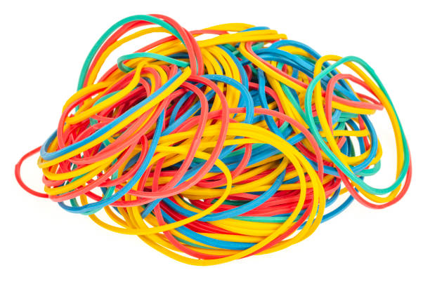istock Many colourful multi coloured elastic rubber bands on white background. 1352124190