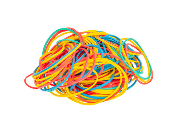 istock Many colourful multi coloured elastic rubber bands on white background. 1352124202