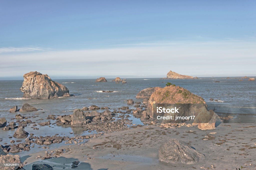 Crescent City California Shoreline Beach and Rocks with Outcroppings This very colorful shoreline view is in Crescent City California with a variety of rocks and small islands along the coast line and on this October day the view is great. California Stock Photo