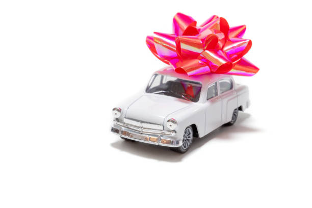 istock White vintage car with red bow isolated on white background 1352125027
