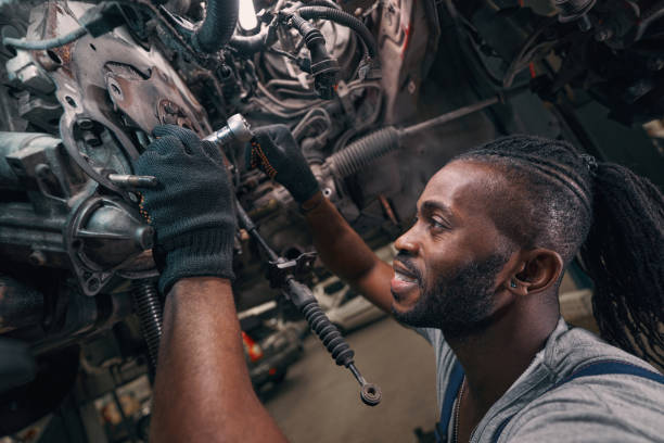 istock Auto mechanic working on clutch plate with socket wrench 1352125044