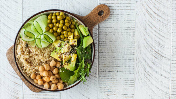 istock Banner healthy vegetable lunch from the Buddha bowl with quinoa, avocado, chickpeas. Copy space. 1352126485