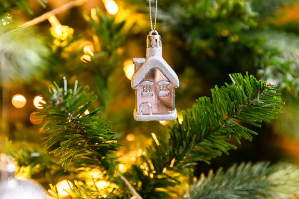 istock Classic Christmas decorated New year tree. Christmas tree with wite and silver decorations, ornaments toy and ball. Modern classical style interior design apartment. Christmas eve at home 1352126579