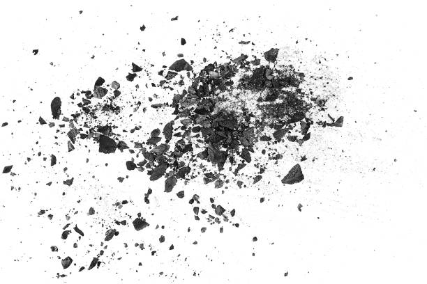 istock Black charcoal particles on a white background, top view. Activated charcoal powder. 1352127314