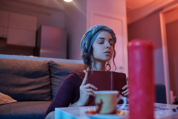 istock Serene fortune-teller attuning to a new deck of cards 1352128768