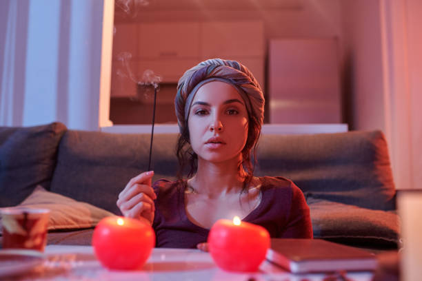 istock Serene young foretune-teller conducting a magic ritual 1352128915
