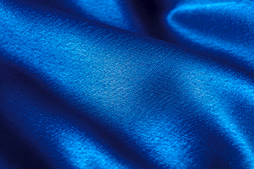 Blue wavy textile background.