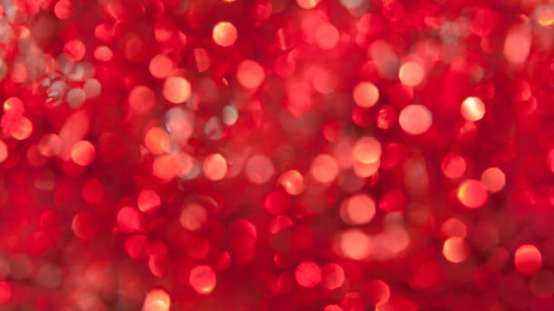 istock abstract red defocused lights background. bokeh abstract background and texture 1352132572