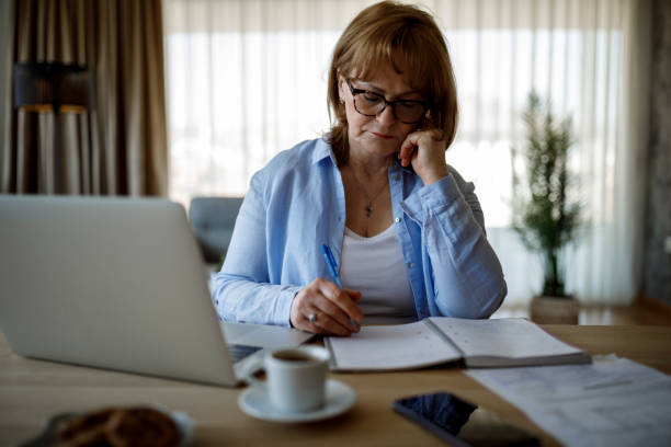 istock Senior woman working at home 1352132668