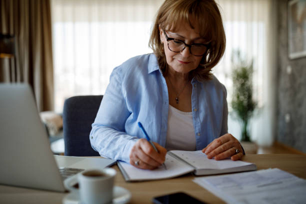 istock Senior woman working at home 1352132670