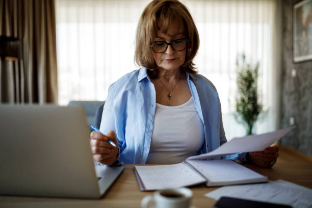 istock Senior woman working at home 1352132708