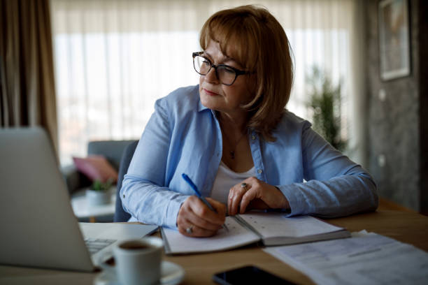 istock Senior woman working at home 1352132781