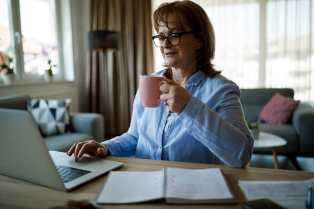 istock Senior woman working at home 1352133461