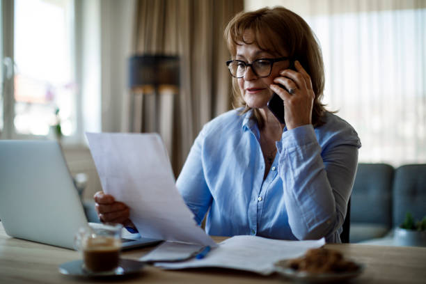 istock Senior woman working at home 1352133526