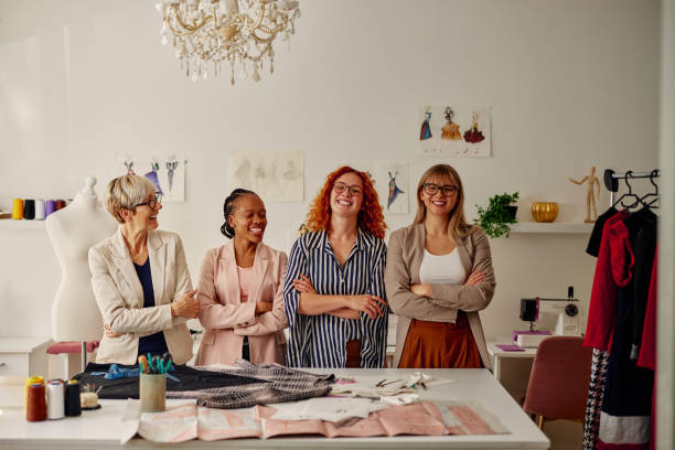istock Four diverse fashion designers at work 1352133755
