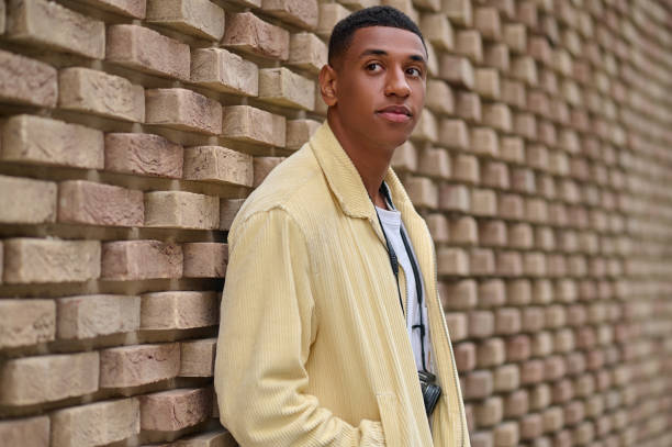 istock Headshot of young dark-skinned man in beige jacket 1352133843