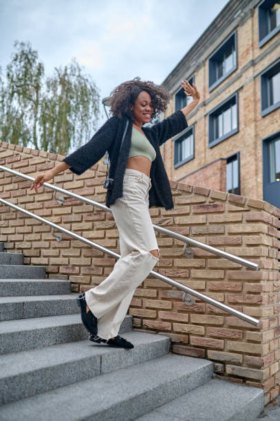 istock A stylish young woman on the steps 1352133943