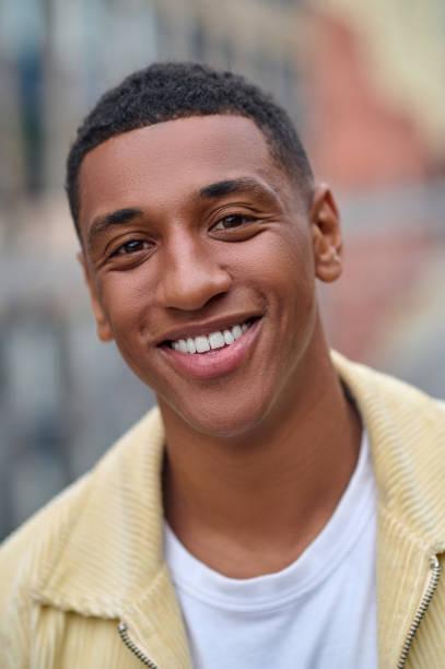 istock Headshot of a smiling handsome young man 1352133975